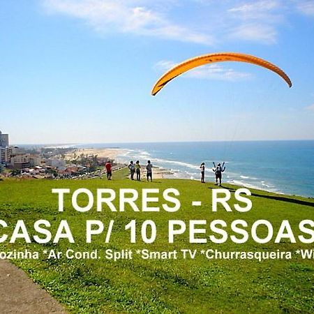 CASA completa em TORRES-RS - O MELHOR CUSTO BENEFICIO na mais bela praia Gaúcha - Cozinha - Banheiro - Ar condicionado - Smart TV 32 Android Apps Youtube - Netflix - Prime Vídeo e Wi-Fi - Estacionamento - Acomoda até 10 pessoas - Anfitriã Superhost n Torres Exterior foto