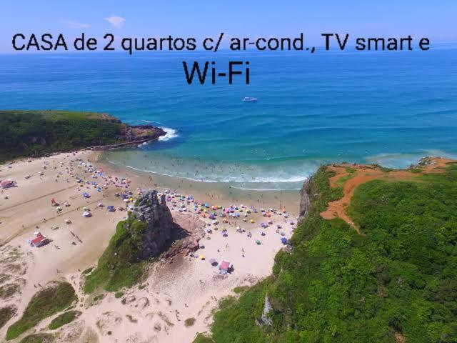 CASA completa em TORRES-RS - O MELHOR CUSTO BENEFICIO na mais bela praia Gaúcha - Cozinha - Banheiro - Ar condicionado - Smart TV 32 Android Apps Youtube - Netflix - Prime Vídeo e Wi-Fi - Estacionamento - Acomoda até 10 pessoas - Anfitriã Superhost n Torres Exterior foto