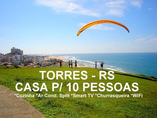 CASA completa em TORRES-RS - O MELHOR CUSTO BENEFICIO na mais bela praia Gaúcha - Cozinha - Banheiro - Ar condicionado - Smart TV 32 Android Apps Youtube - Netflix - Prime Vídeo e Wi-Fi - Estacionamento - Acomoda até 10 pessoas - Anfitriã Superhost n Torres Exterior foto