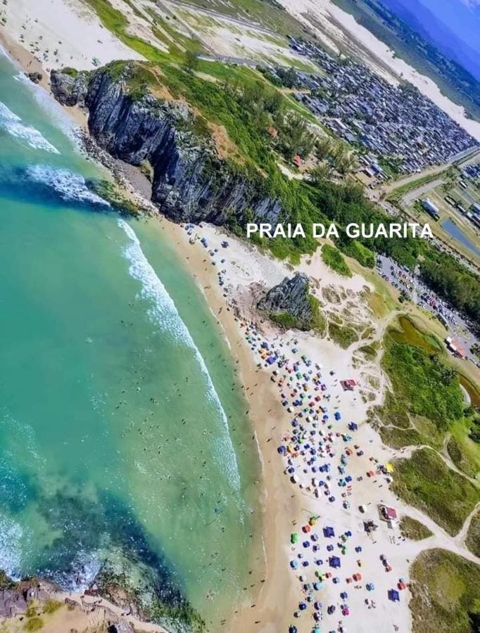 CASA completa em TORRES-RS - O MELHOR CUSTO BENEFICIO na mais bela praia Gaúcha - Cozinha - Banheiro - Ar condicionado - Smart TV 32 Android Apps Youtube - Netflix - Prime Vídeo e Wi-Fi - Estacionamento - Acomoda até 10 pessoas - Anfitriã Superhost n Torres Exterior foto