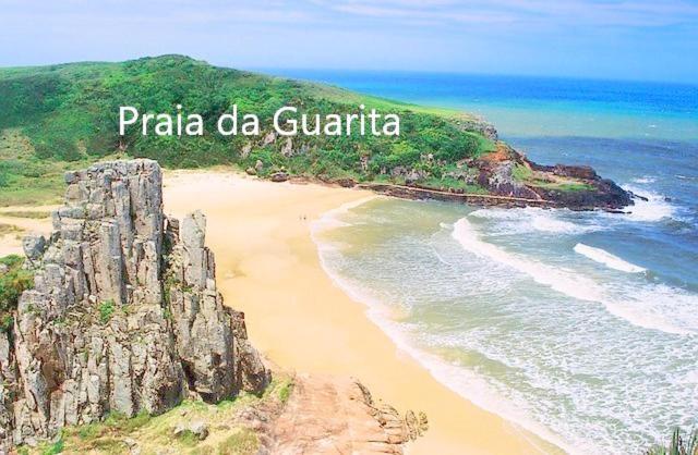 CASA completa em TORRES-RS - O MELHOR CUSTO BENEFICIO na mais bela praia Gaúcha - Cozinha - Banheiro - Ar condicionado - Smart TV 32 Android Apps Youtube - Netflix - Prime Vídeo e Wi-Fi - Estacionamento - Acomoda até 10 pessoas - Anfitriã Superhost n Torres Exterior foto